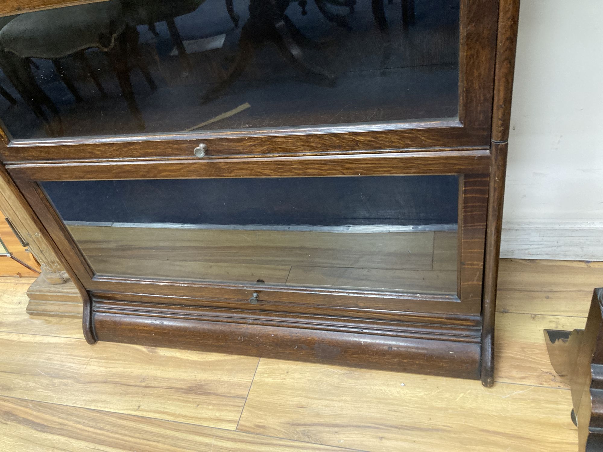 A Globe Wernicke style oak four section bookcase, width 88cm depth 30cm height 140cm